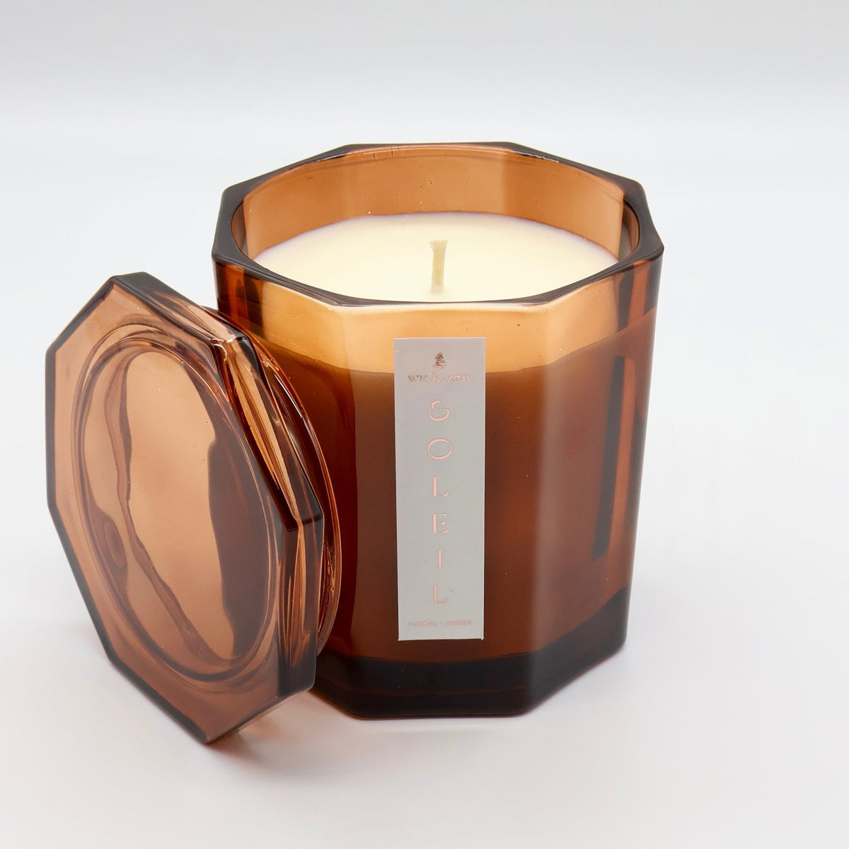 Wick-Zen Soleil limited edition candle with lid off, amber octagonal glass jar
